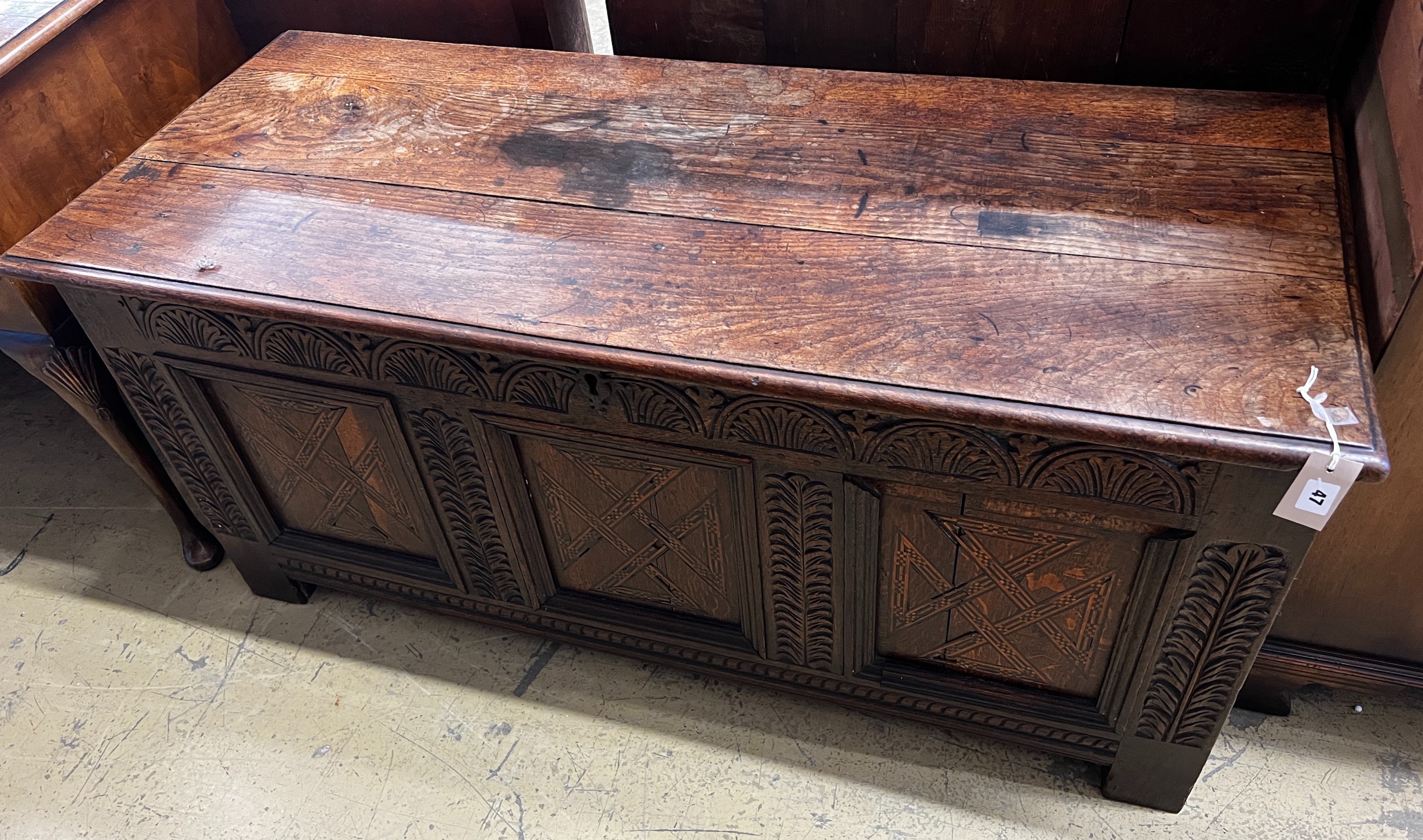 An 18th century inlaid oak coffer, length 133cm, depth 54cm, height 61cm